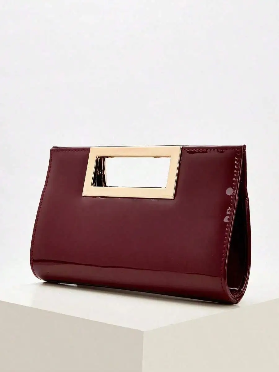 Elegante bolso de mano de charol color burdeos con asa de marco para fiestas y negocios