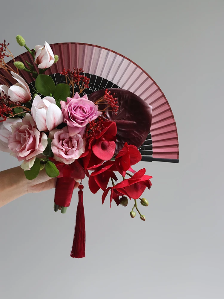 Folding fan Chinese red hand holding simulated flower rose Phalaenopsis cheongsam Xiuhe bridal wedding ceremony photography home