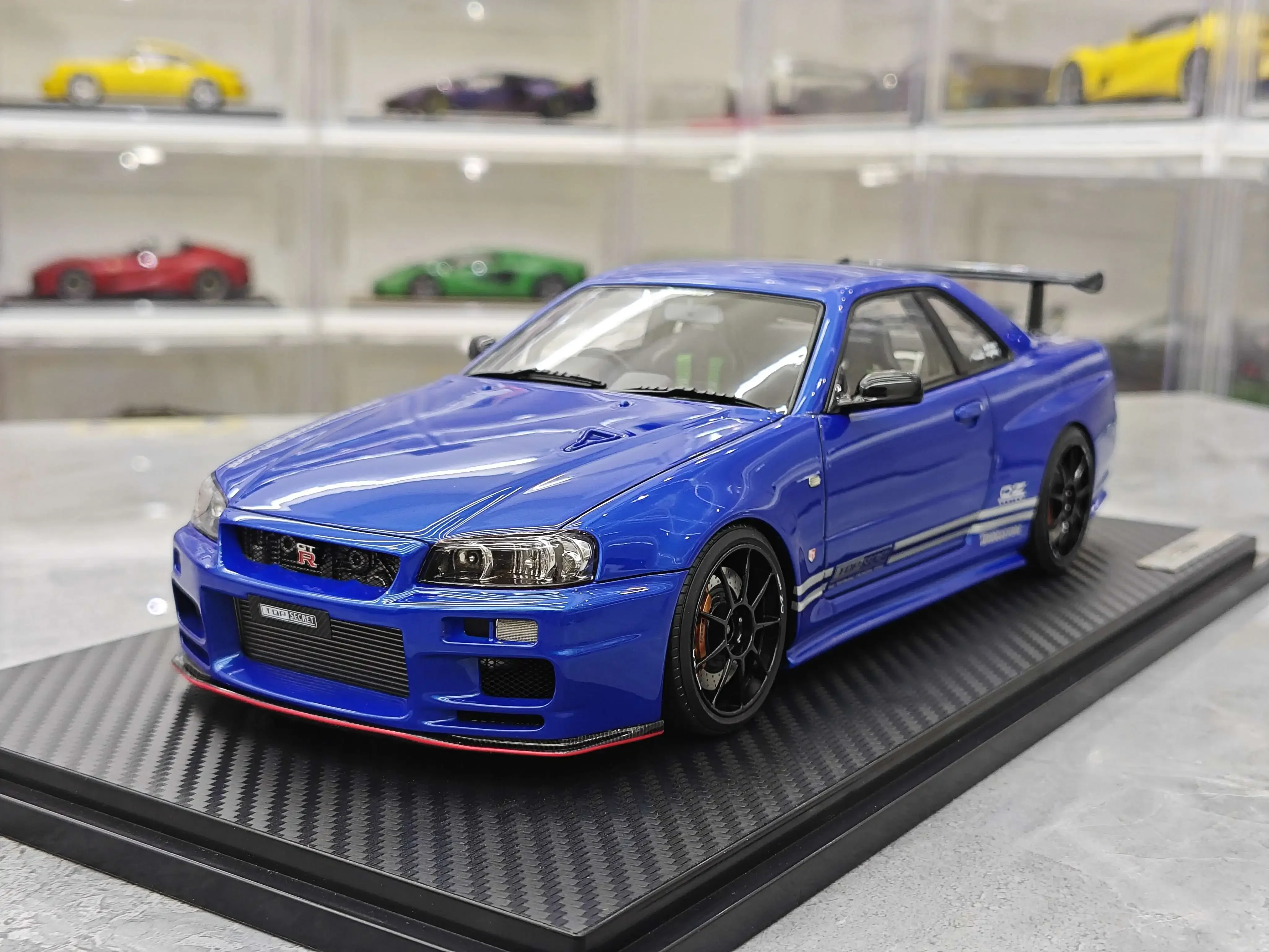 

Масштабная модель автомобиля IG 1:18 GTR BNR R34 TOP SECRET Blue JDM, лимитированная серия, из смолы и металла, статическая, коллекционная, подарок