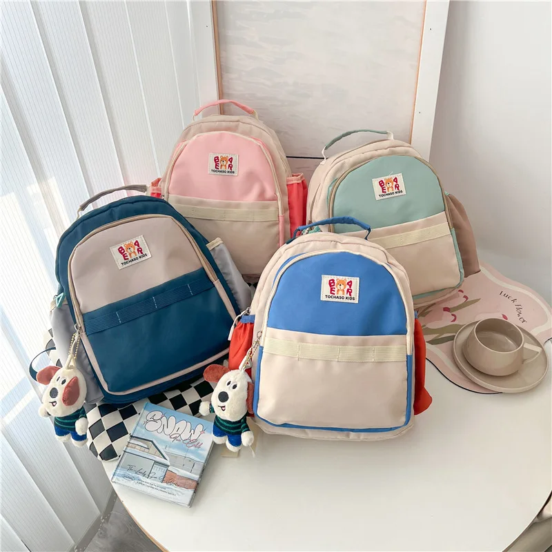 Neue Kinder taschen für Mädchen Jungen Rucksack mit Hundes pielzeug tragbare Kinder Schult asche koreanische Baby Umhängetasche für die Reise