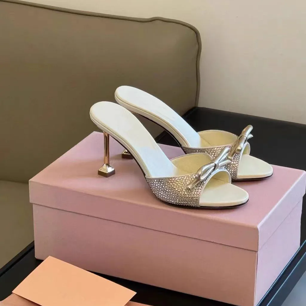 

Bow rhinestone one-word sandals for women to wear 2026 summer new black round head open-toed temperament high heels