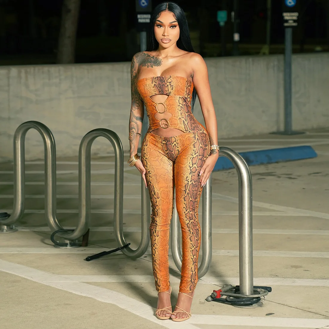 

Orange Serpentine Print Metal Rings Hollow Out Strapless Jumpsuits Women Sexy Sleeveless Backless Tight Night Clubwear Overalls