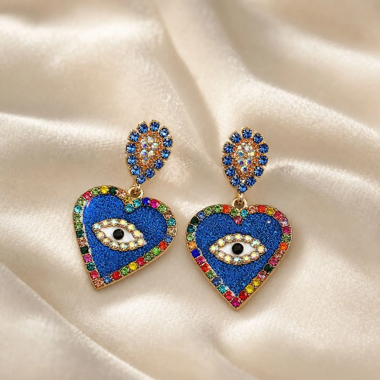 Cross border fashion temperament, creativity, high-end feeling, heart-shaped angel's eye alloy, pearl and diamond earrings