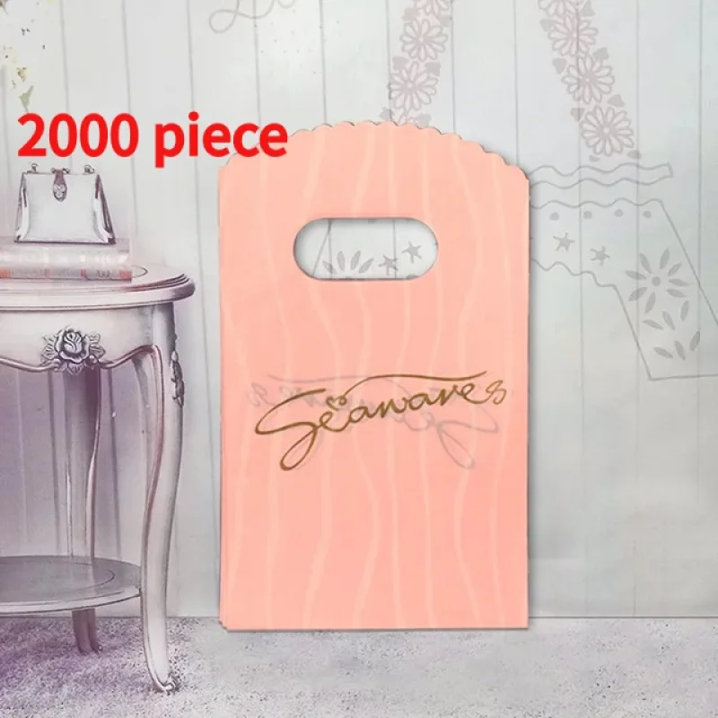 

20 00piece. custom. Custom merchandise glossy plastic handle pink shopping retail bags clothing packing with logo