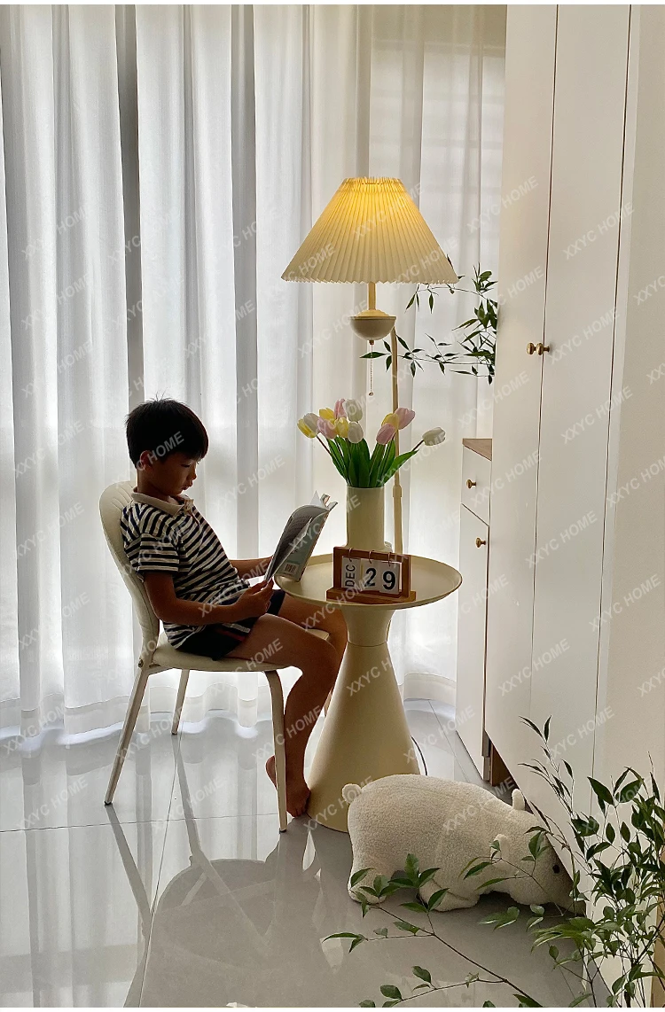 DF Cream wind living room sofa next to a few floor light sources integrated storage coffee table rack