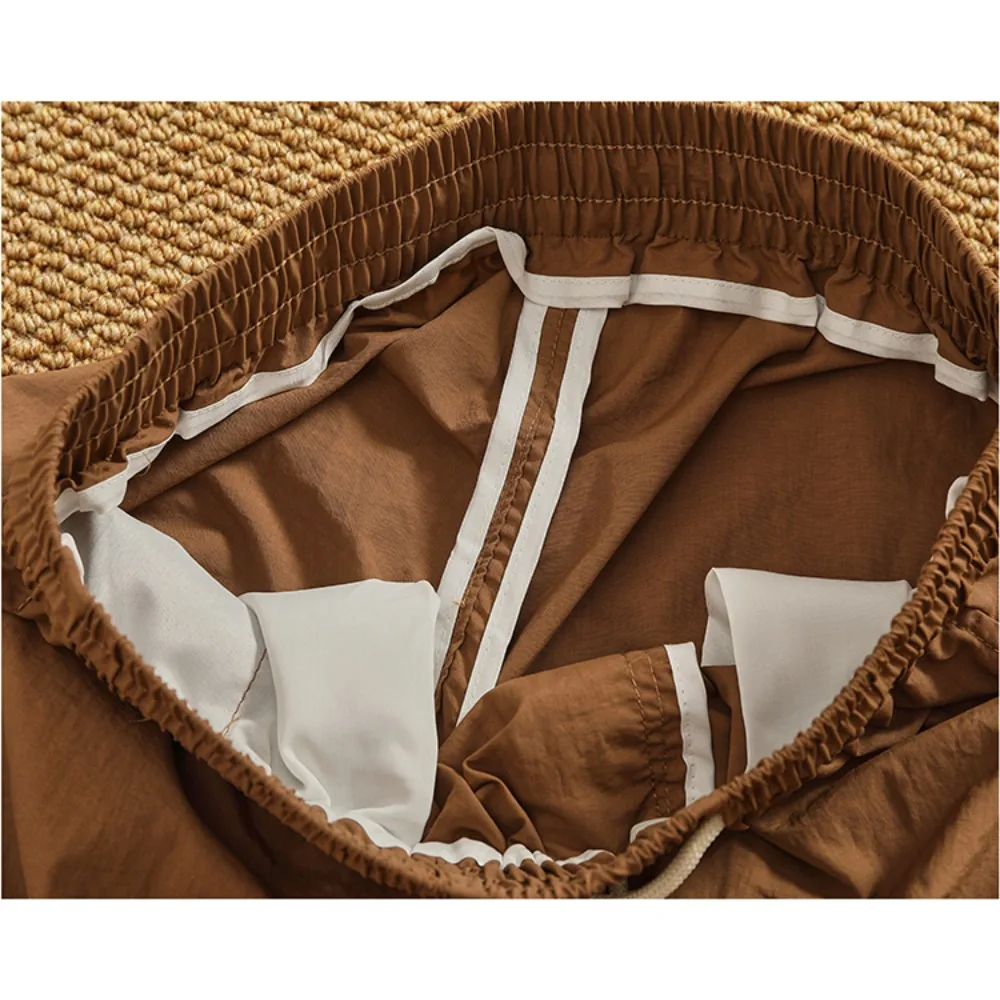 شورت سريع الجفاف للرجال بنمط جديد شورت عمل عصري وفضفاض للرجال صيفي متعدد الاستخدامات سروال خمس نقاط غير رسمي