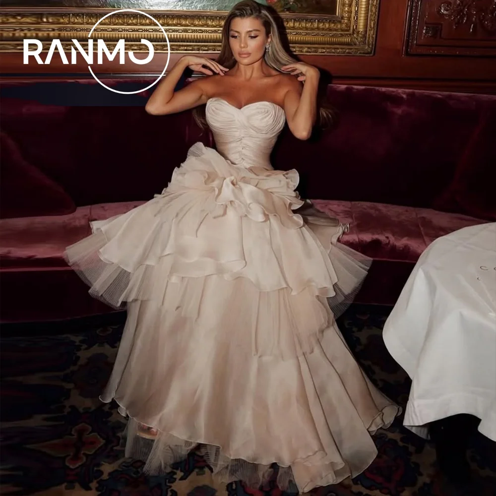 Ranmo الشمبانيا فستان زفاف رائع على شكل حرف a بدون حمالات بدون أكمام 2026 فستان زفاف دانتيل مخصص طبقات مطوي سويب تراين #1