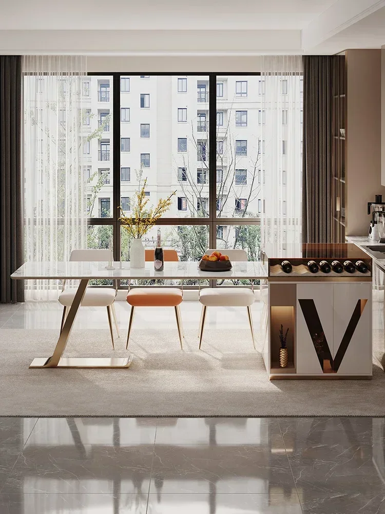 Mesa isleña telescópica integrada de lujo, con superficie de roca de alta calidad, estilo celebridad online, y gabinete isleño multifuncional.