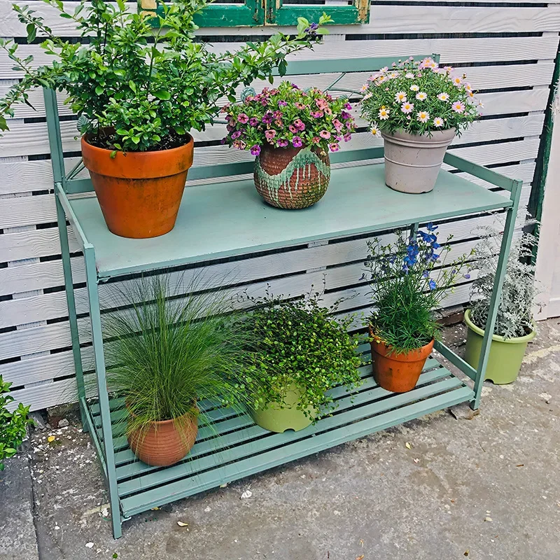 Outdoor gardening console, multi-story, wrought iron garden rack, tool work, display stand, long table against wall