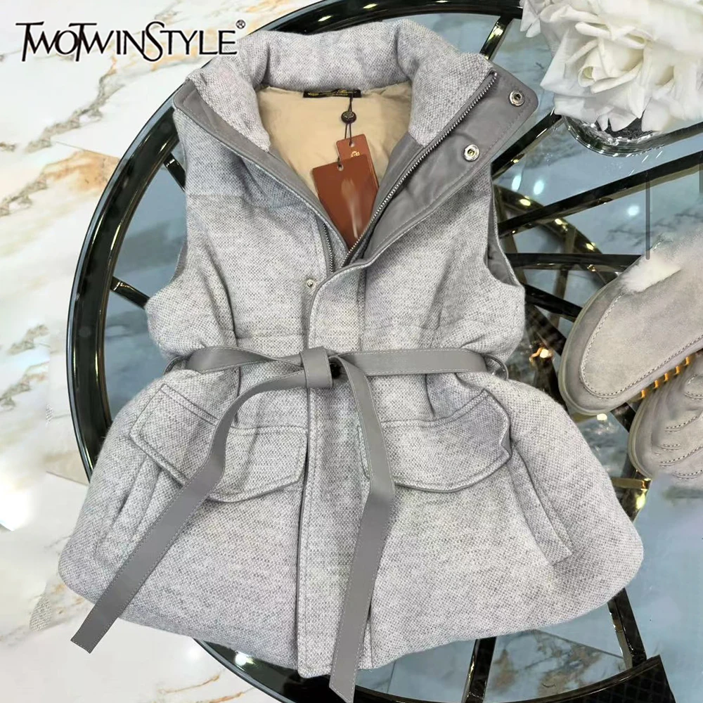 

TWOTWINSTYLE Solid Loose Casual Jackets For Women Stand Collar Sleeveless Spliced Belt Temperament Coat Female Style KVEB548512