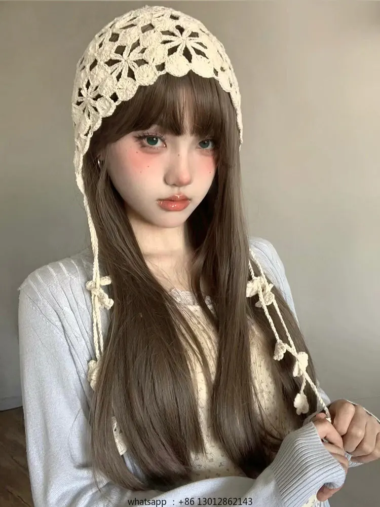 

Вязаная вручную головной убор с цветочной бахромой