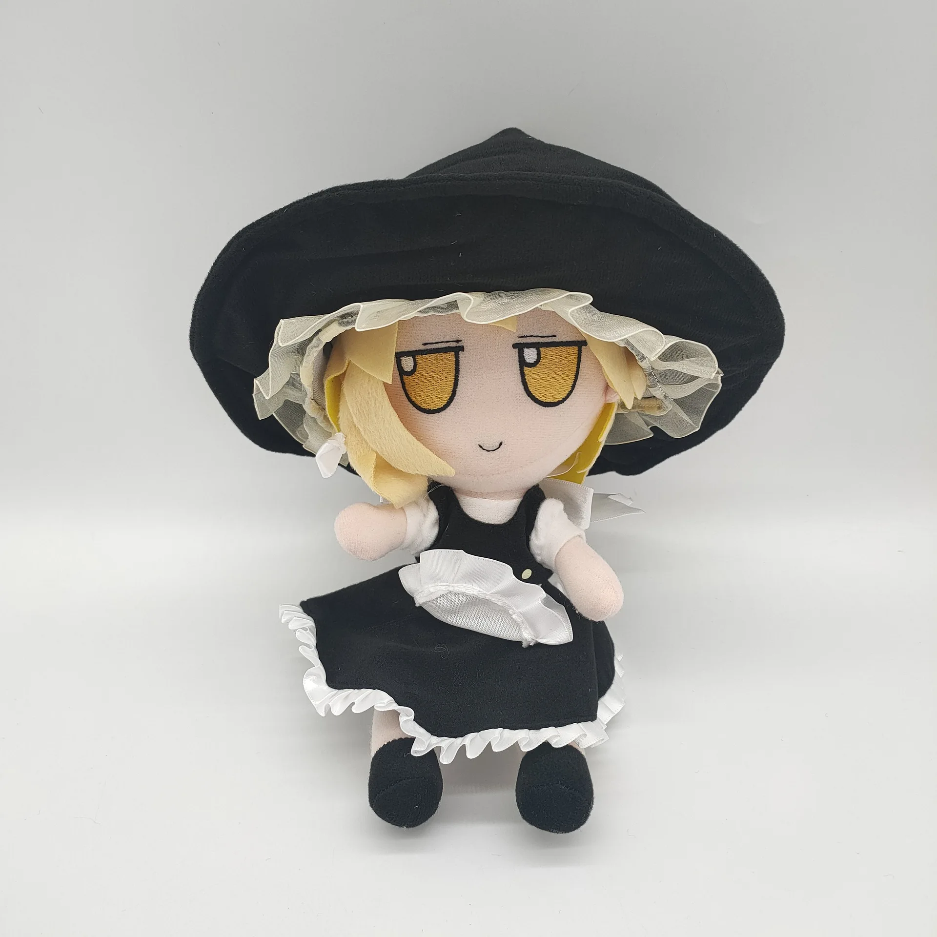 Yellow haired little girl wearing black hat, plush toy, creative design, cute and fun, soothing and accompanying