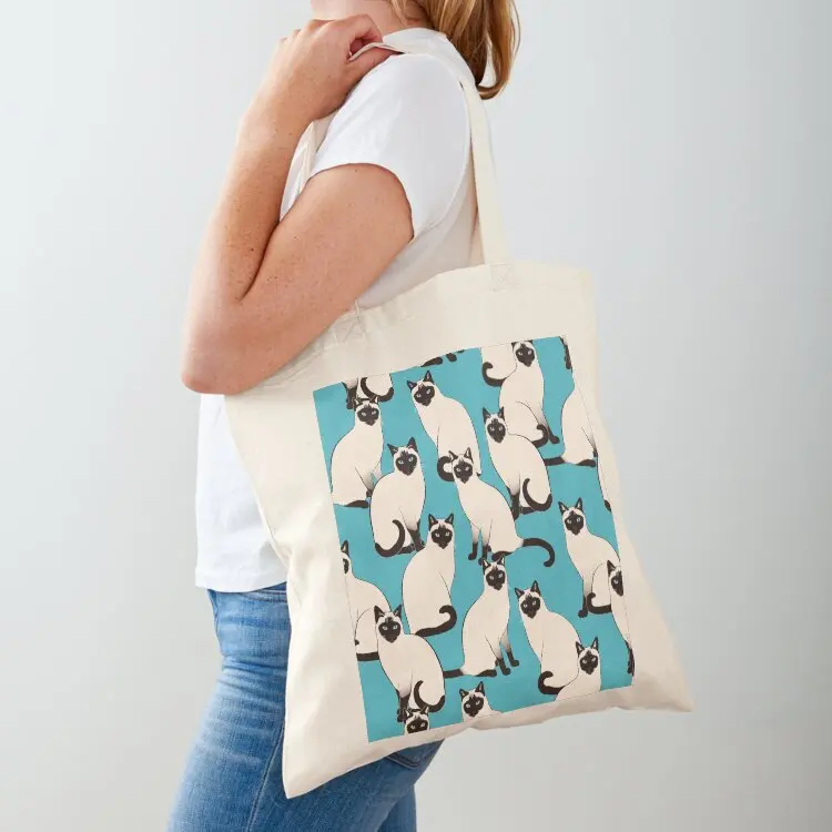 

Siamese Cats dense on turquoise Tote Bag shopping trolley bag bags luxury women women bag tote university