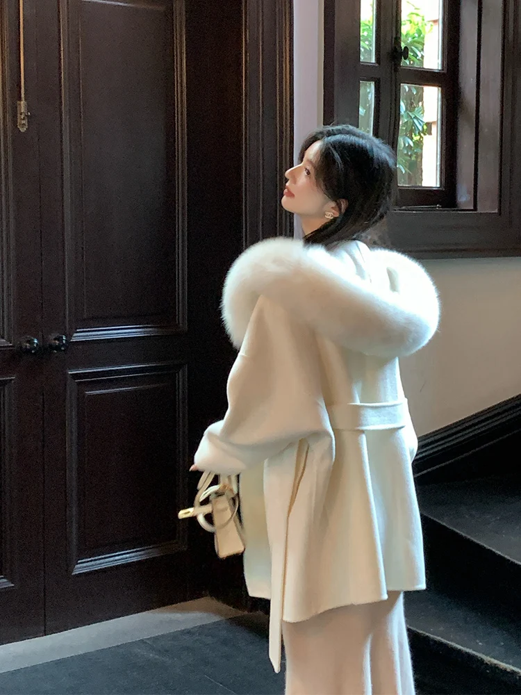 Płaszcz Moonlight Coat dla kobiet na jesień i zimę 2025 to wełniany płaszcz z kapturem i futrem z lisicy, nowy płaszcz dwustronny z kaszmirem.