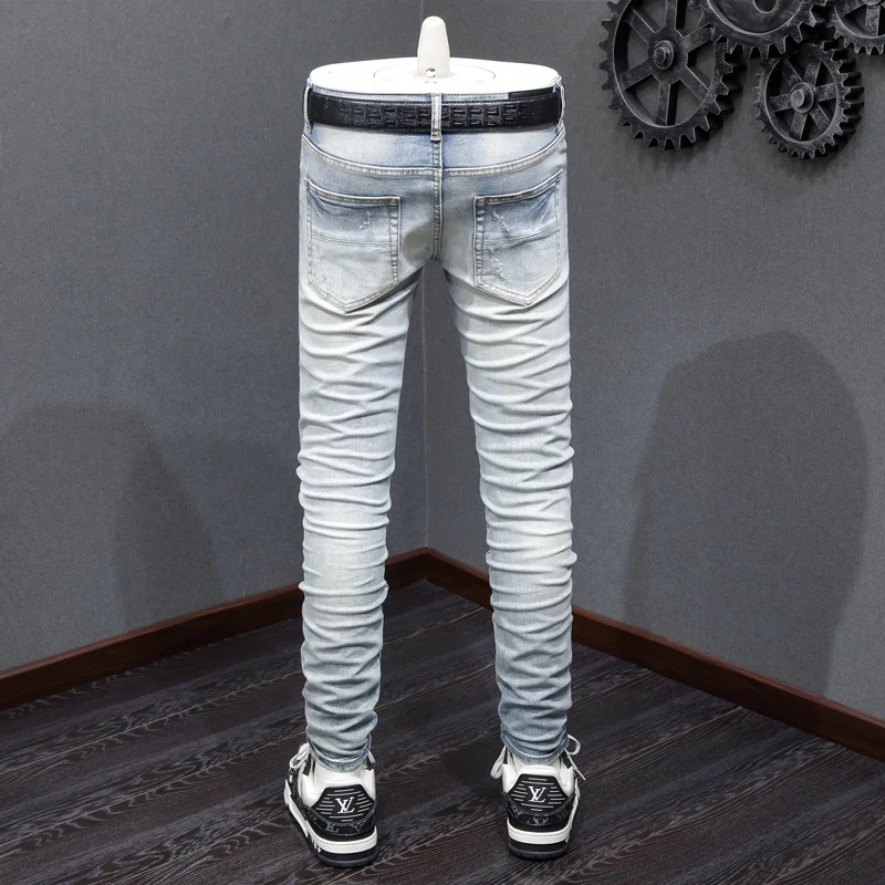 Street designer fashionable men's jeans retro light blue elastic tight corrugated jeans men's black patch hip-hop brand pants ho