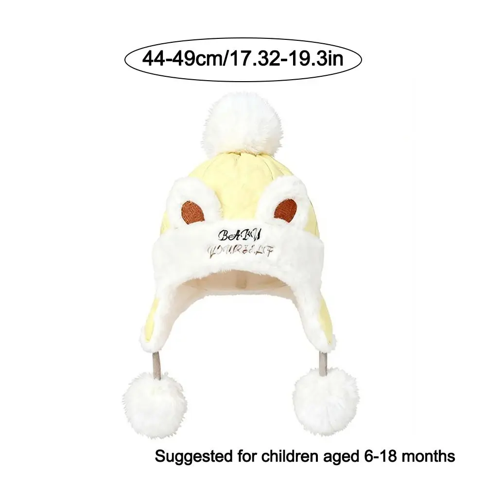 Nieuwe warme winterbabymuts met bont gevoerde winddichte oorbeschermingshoeden met baloorflap