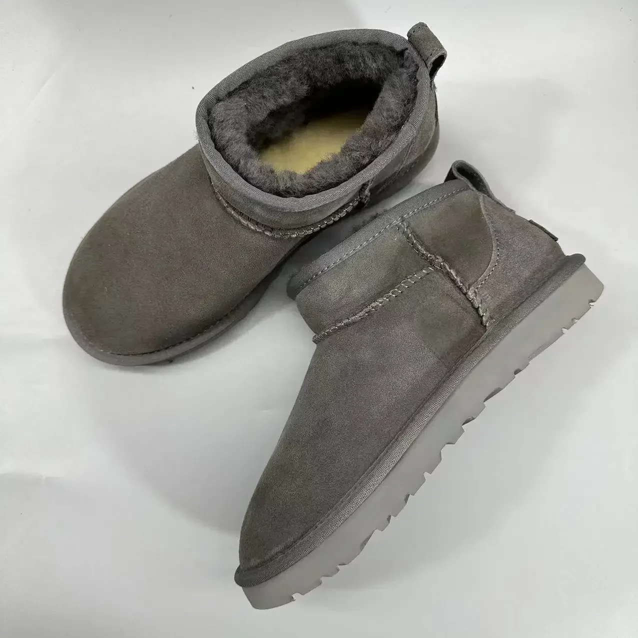 Botas curtas de lã de carneiro real para homens e mulheres, sapatos de pele quente para senhoras, botas de neve de alta qualidade inverno