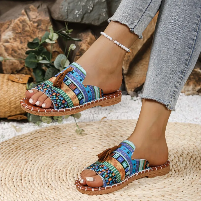 Pantofole con nappe stile nazionale per donna 2025 Primavera ed estate Nuove mezze pantofole con punta aperta in sughero piatto versatile retrò Taglie forti