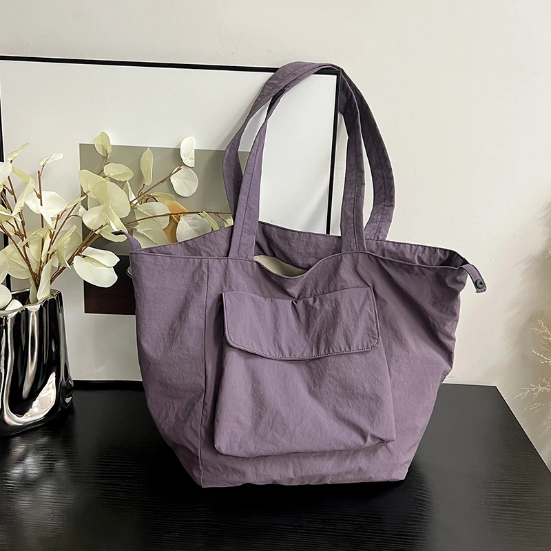 Bolsas de ombro casuais de nylon macio para mulheres, grande capacidade, linha de costura, bolsas versáteis, com zíper monocromático, venda quente, 2024