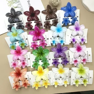 Pince de requin fleur de plumeria colorée 3Pcs, pince à cheveux Bohemian queue de cheval, barrette en plastique barrette d’été 10 meilleurs accessoires flower power en vente - No 5