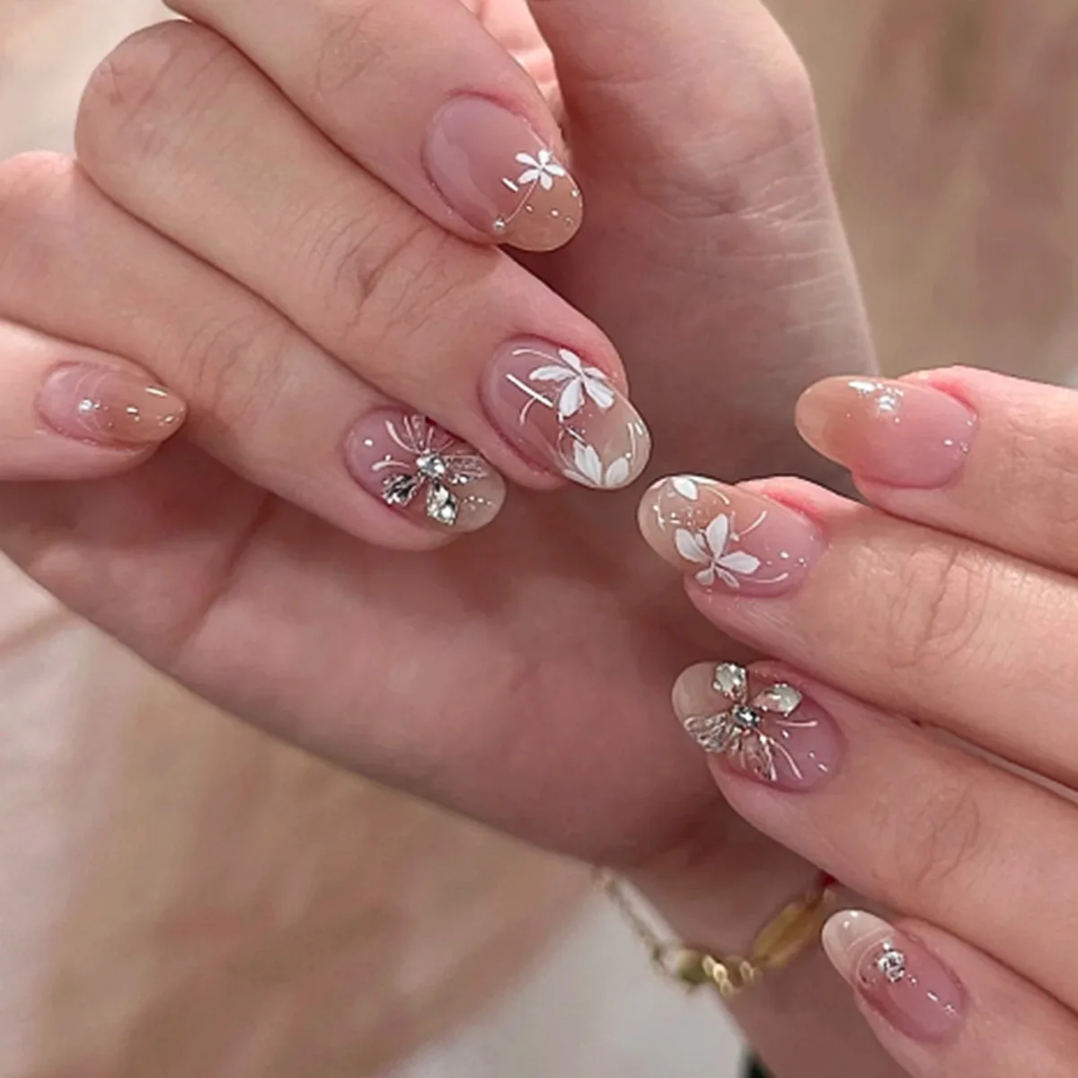 

24Pcs Short Round Head False Nails with White Flower Fake Nails Press on Butterfly Rhinestone Pearl Reusable Full Cover Nail Tip