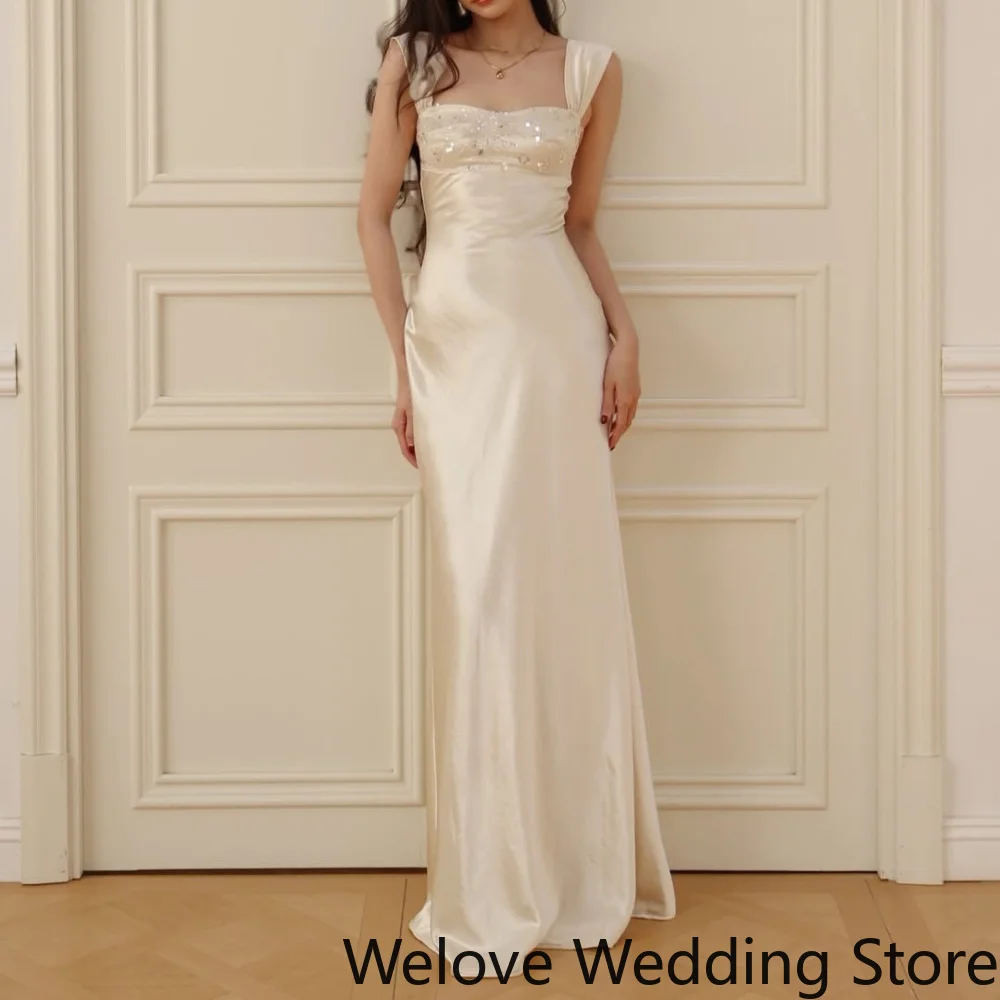 Elegant Ivory Formal Slip Dress featuring a square neckline, delicate sequin detailing on the bust, and wide shoulder straps