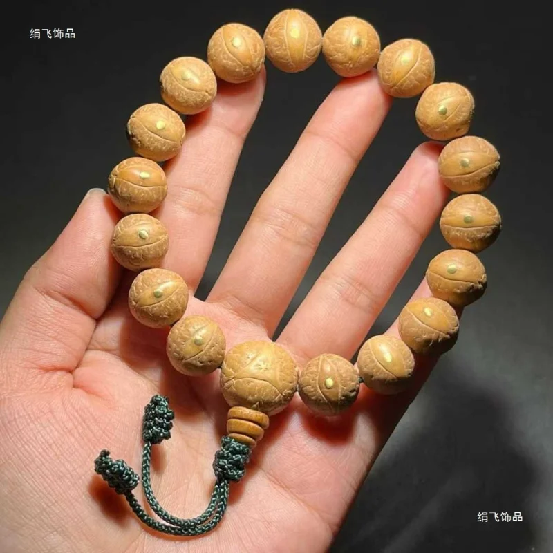 Natural round Nepalese red and yellow Phoenic-eye Bodhi beads inlaid with copper nails, original single-strand hand-held Buddhis