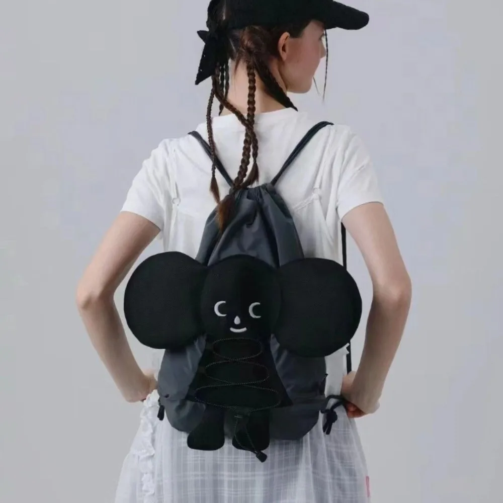 

Cute Casual Cartoon Backpack Drawstring Adorable Doll School Bag Large Capacity Lightweight Black Double Shoulder Bag Travel