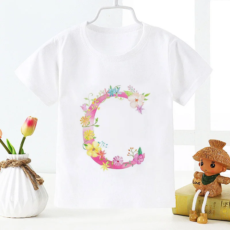 Camiseta informal de manga corta para niños y niñas, Camiseta con estampado de dibujos animados, 26 letras en inglés, nombre de flor, ABC, cuello redondo