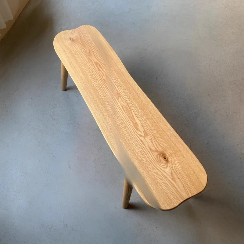 

Cream log style irregular ash log bench