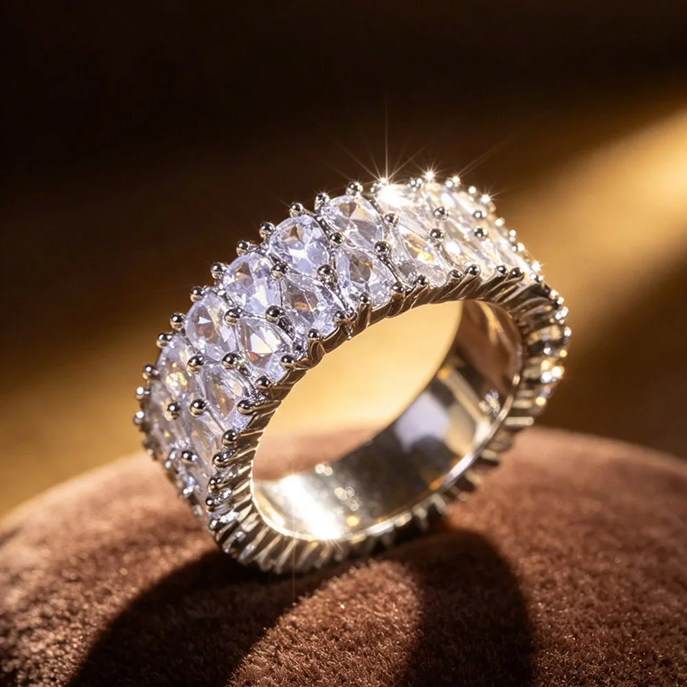 1Pc wide full eternity ring for women ladies, fully set with teardrop shiny zircon surrounded by tiny crystal accents. Full-circle luminous design, ideal for daily styling, banquet and anniversary wear.