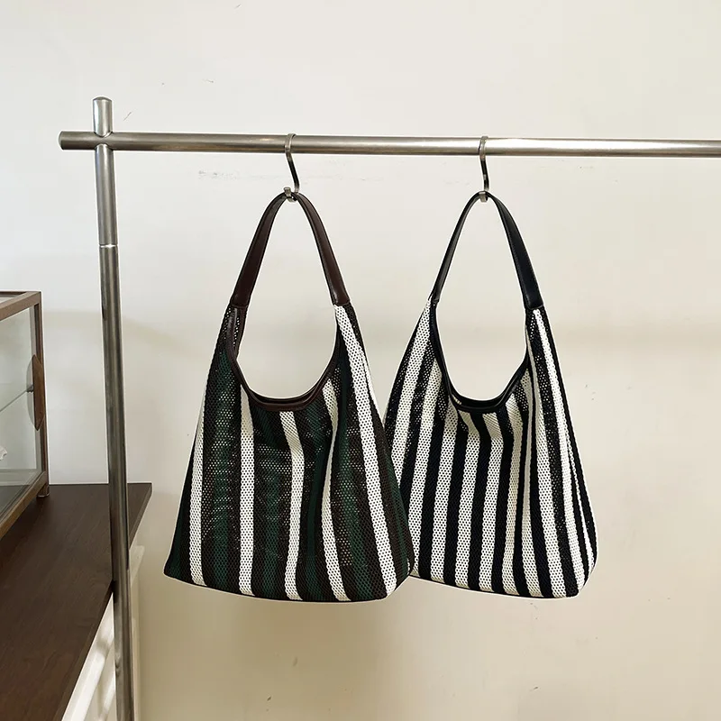 

2025 Korean Style Ins Hollow Stripe Woven Bucket Bag Women Simple Versatile Vacation Shoulder Bag