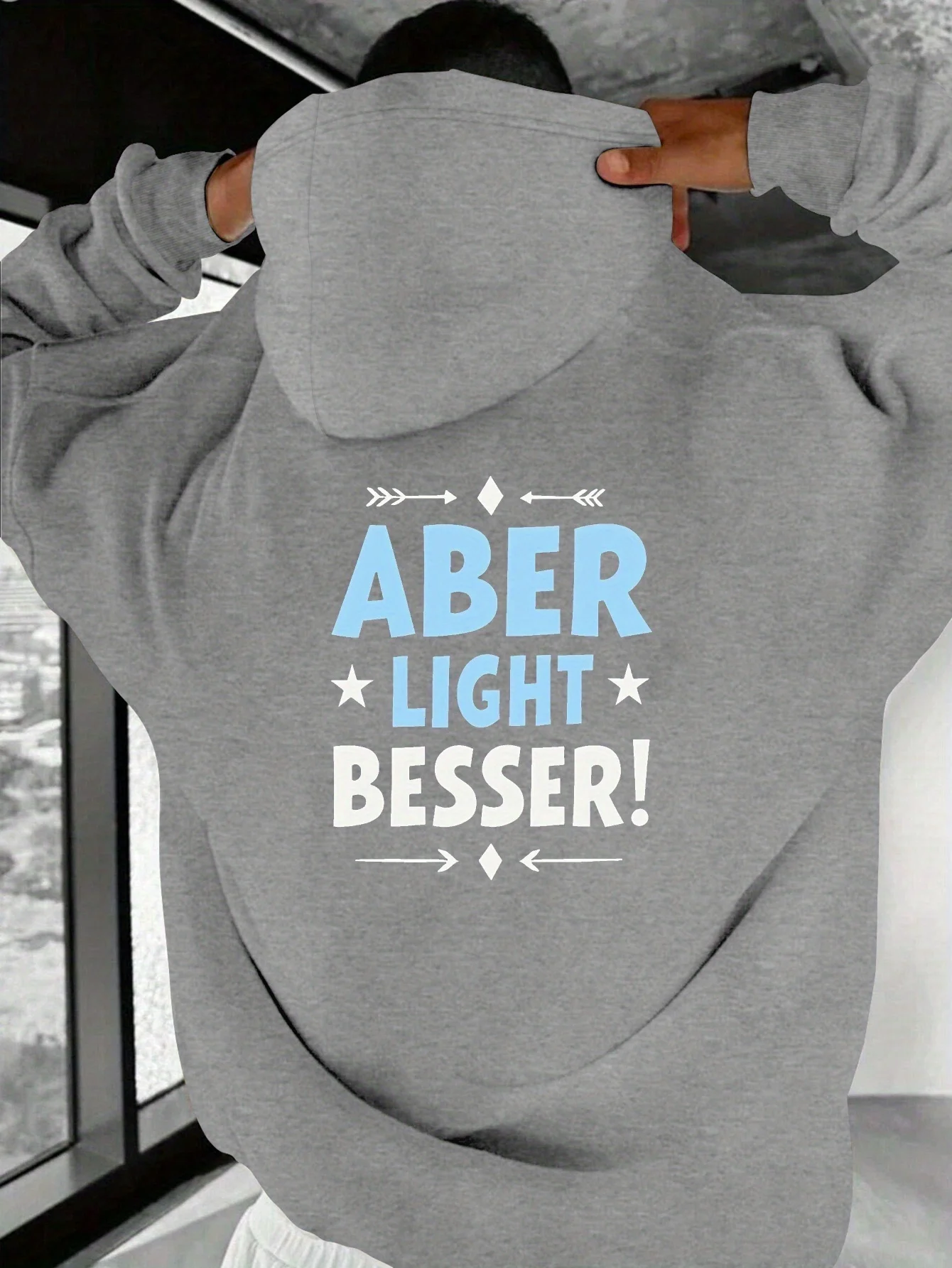 

Men's hooded sweatshirt, featuring bold German text "ABER LIGHT BESSER!"