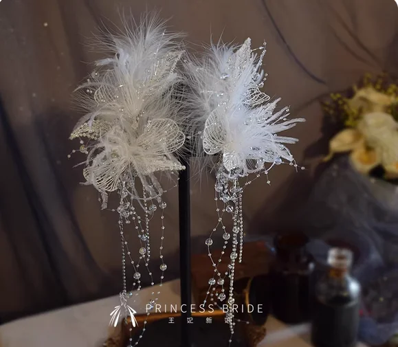 Bridal headdress feather white lace super fairy princess beautiful fashion temperament elegant tassel clip wedding accessories.