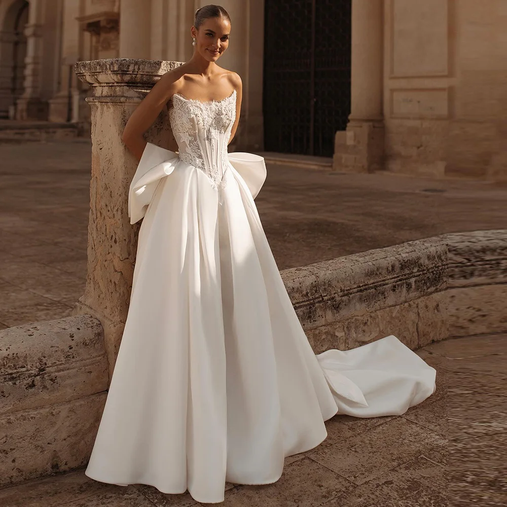 

High Quality Handmade Flowers Wedding Dress Customized Fashion Satin Sleeveless Bridal Gowns Dreamy Beading Bow Vestido De Novia