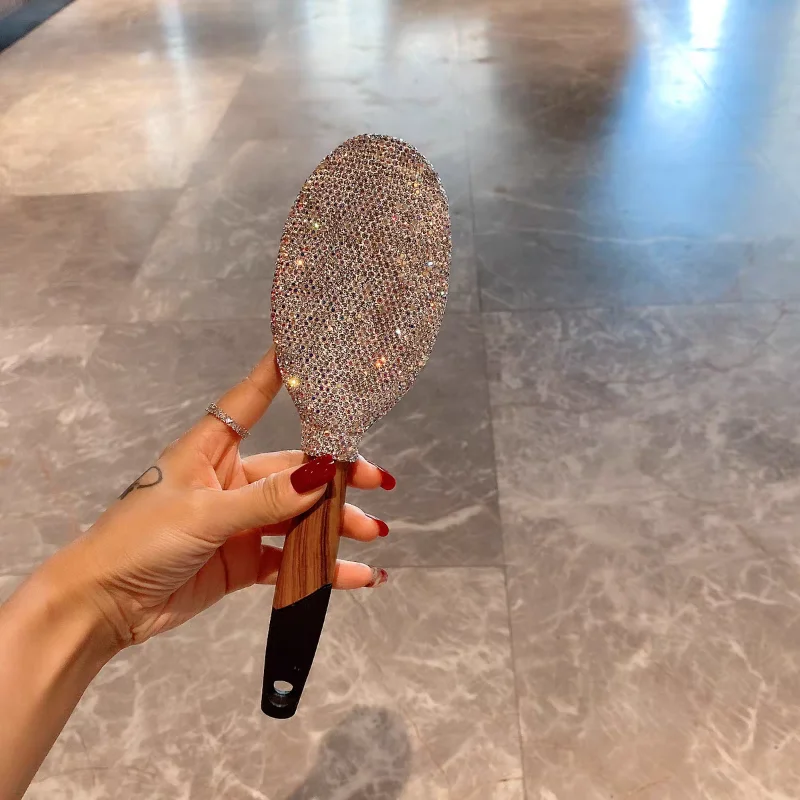 Luxurious long-handled air cushion comb with artificial diamonds for home use. Airbag comb with innovative anti-static and anti-
