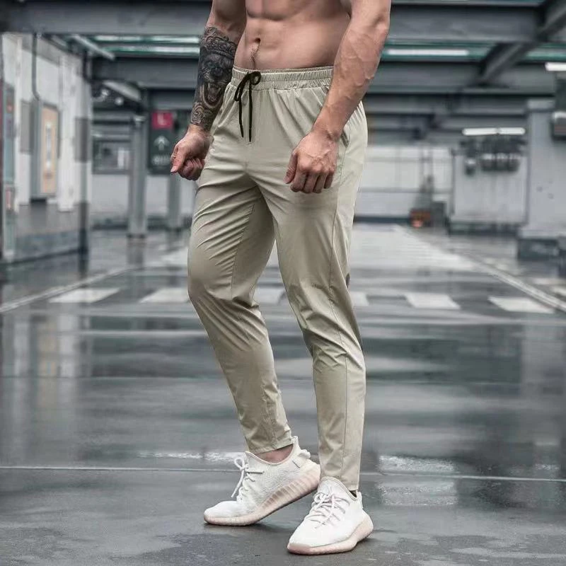 Calças esportivas elásticas para homens moletom de corrida para treinamento ao ar livre calças de ginástica leggings de bolso com zíper verão