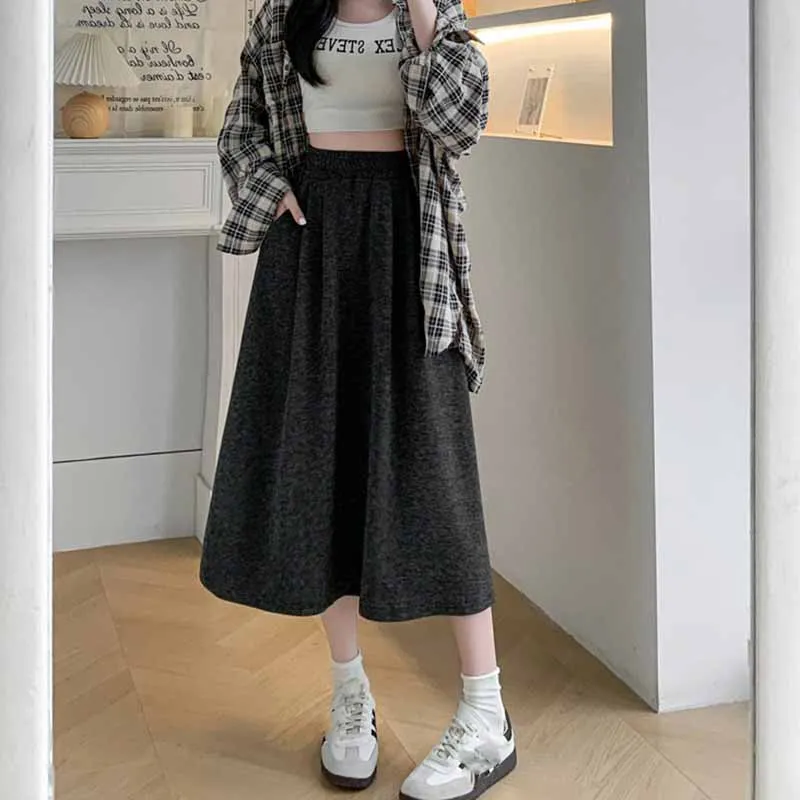 Cor sólida casual com bolsos a linha saias femininas coreano emagrecimento elástico de cintura alta saia longa mulher versátil midi saias