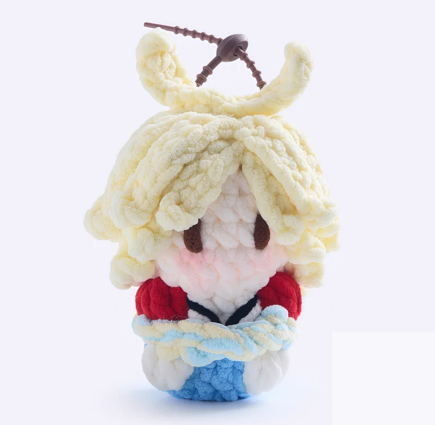 Handmade crocheted plush doll keychains and bag charms for celebrity merchandise and concert support.