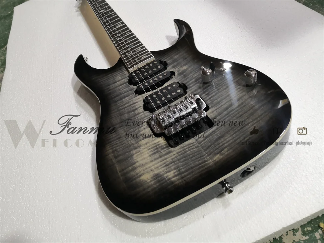 6 string electric guitar, black guitar, flamed maple veneer, flower fretboard, tremolo bridge, 5 pieces of wood neck