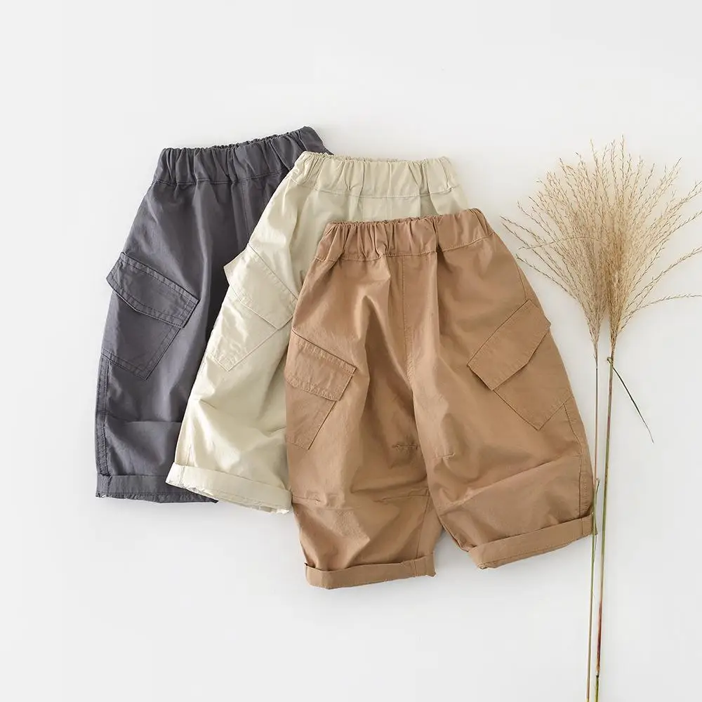 

2026 Брюки для младенцев, детская одежда, новые весенние повседневные штаны для малышей, однотонные свободные шаровары для девочек, штаны-карго с карманами для маленьких мальчиков