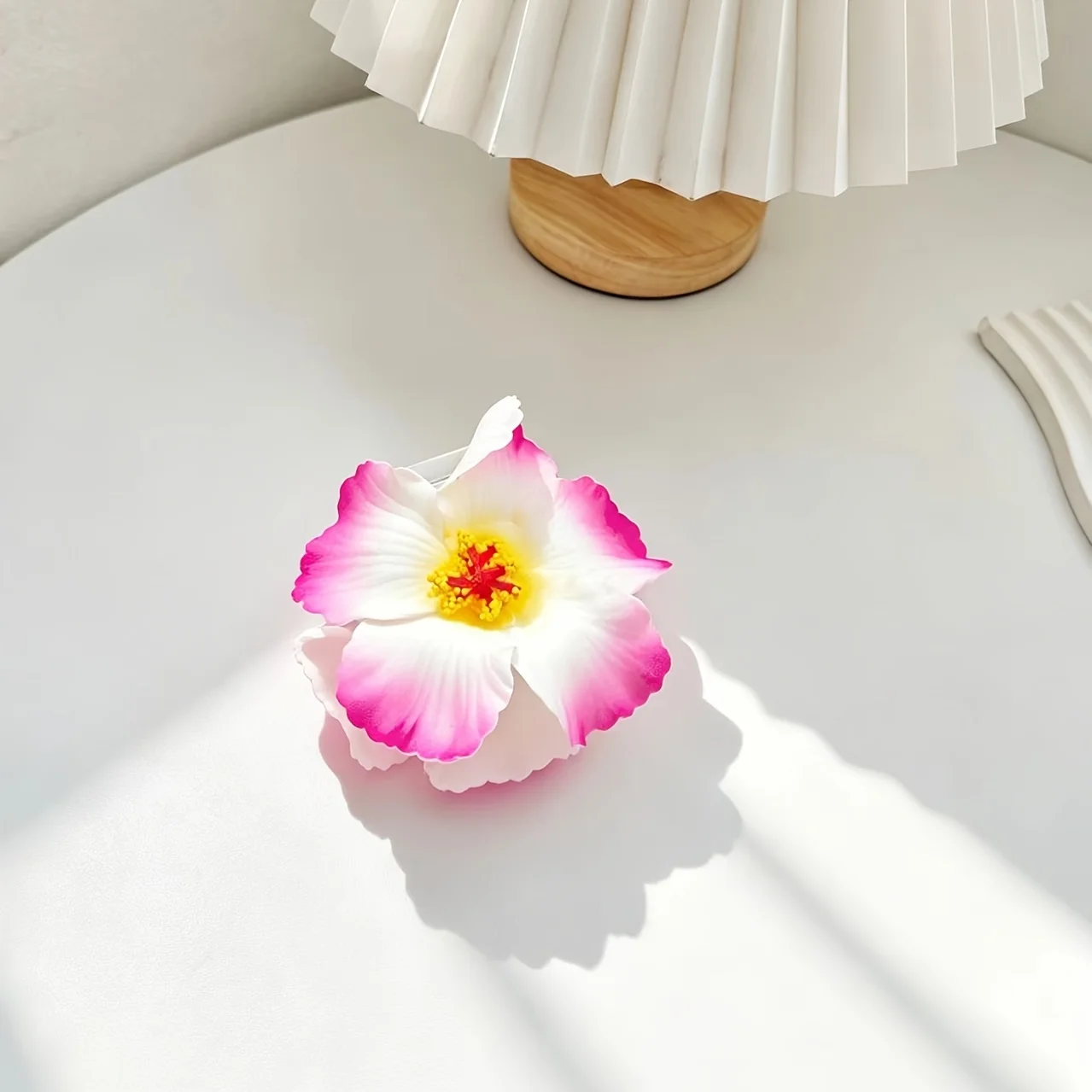1 piece beach-style faux sunflower pink hair clip for women, creating a romantic beachy vibe for photo shoots—side hair clip for