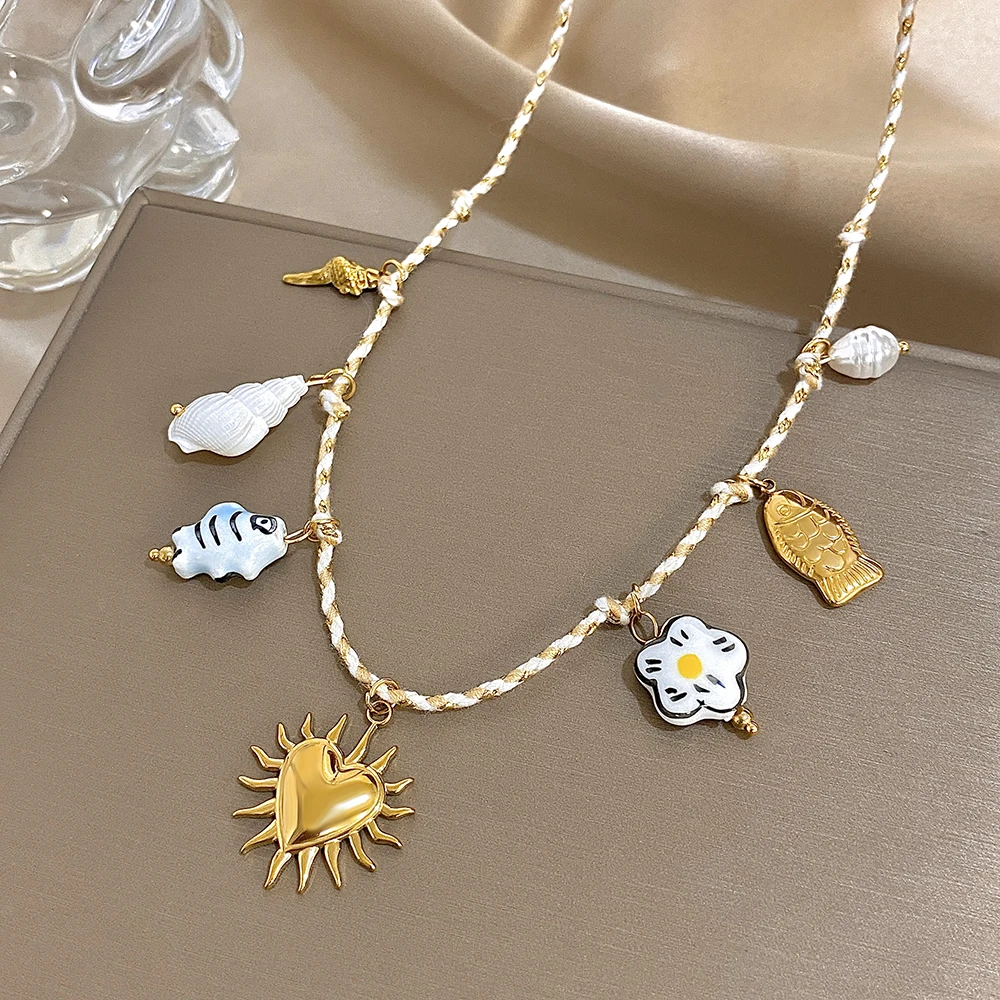 

Freetry Stainless Steel Love Heart Fish Conch Pendant Necklace for Women Boho Woven Rope Chain Choker Ocean Styles Neck Jewelry