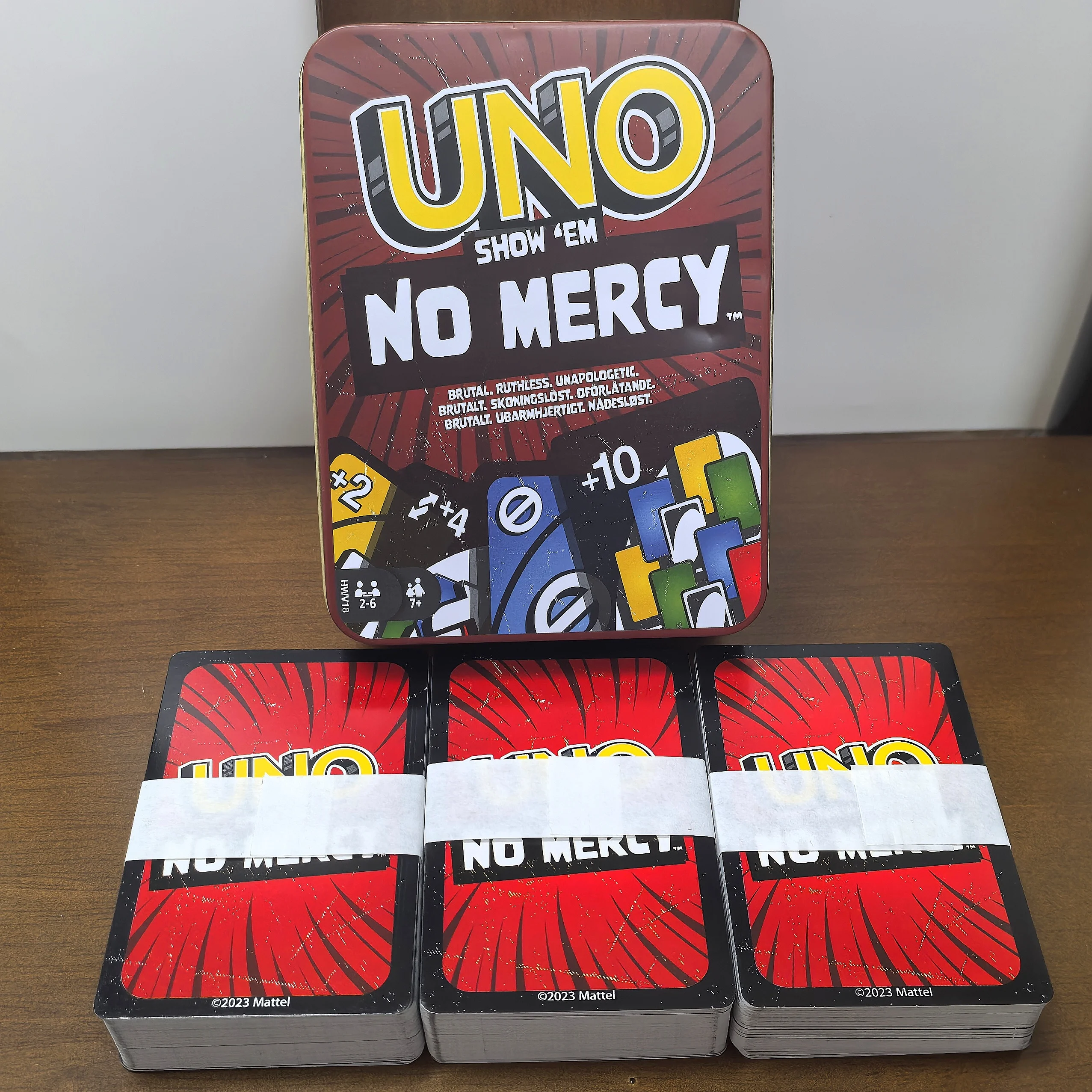 

Iron box Mattel Games UNO Show 'em No Mercy Card Game in Travel Tin With Extra Cards Special Rules & Tougher Penalties UNO Cards