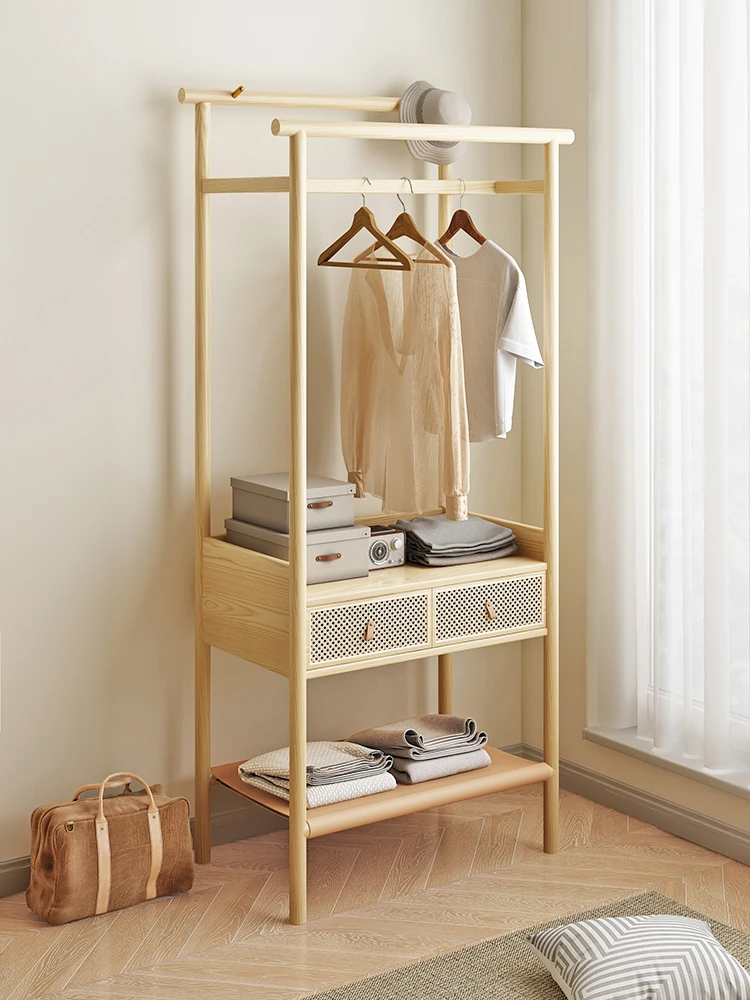 

Nordic rattan clothes rack solid wood floor high-grade clothes rack bedroom clothes rack simple and modern.