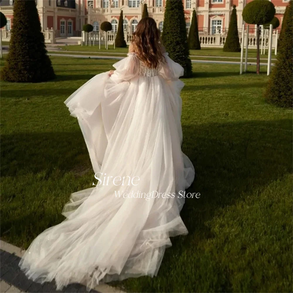 فستان زفاف Sirene رائع مزين بالدانتيل بدون أكتاف وأكمام منفوشة من التل أنيق على شكل حرف a على شكل قلب بطول الأرض فستان زفاف