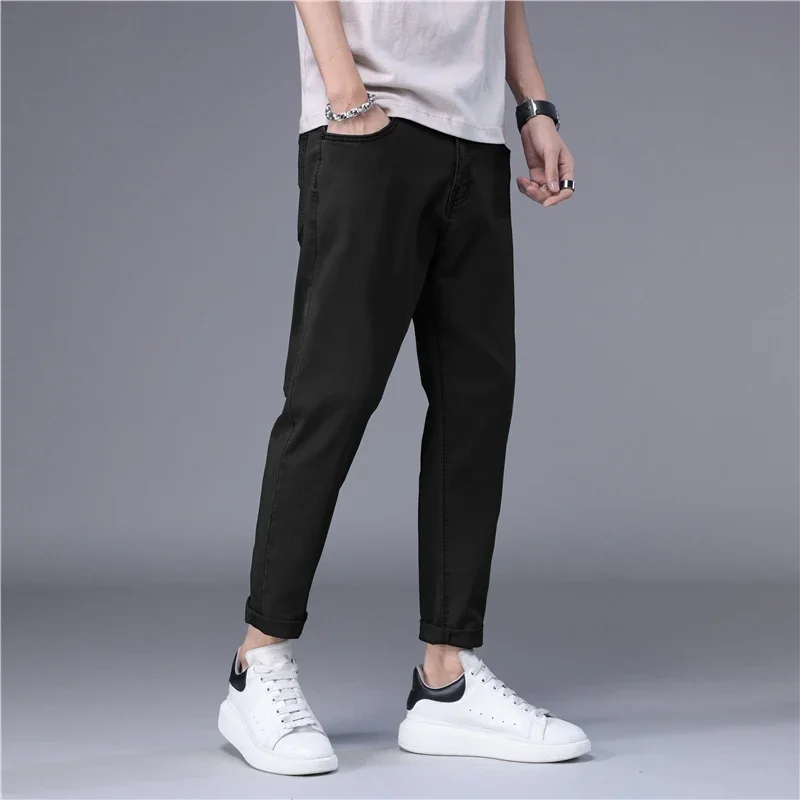 ฤดูร้อนกางเกงยีนส์ผู้ชายบางสไตล์เกาหลีสีฟ้าสีดําสีทึบยืดตรงสไตล์ SLIM FIT เท้า DENIM Cropped กางเกงชาย