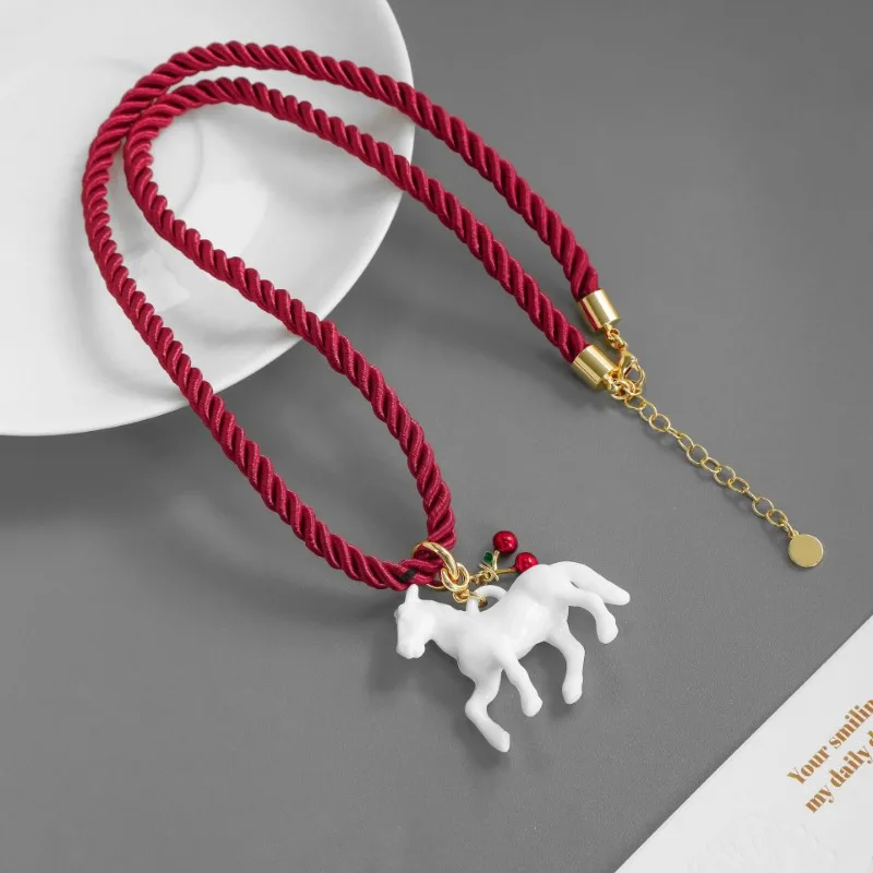 

2025 New Arrival Autumn Winter Style Cute Small White Horse Charm Red Rope Necklace Simple Niche Design Personalized Resin Chain