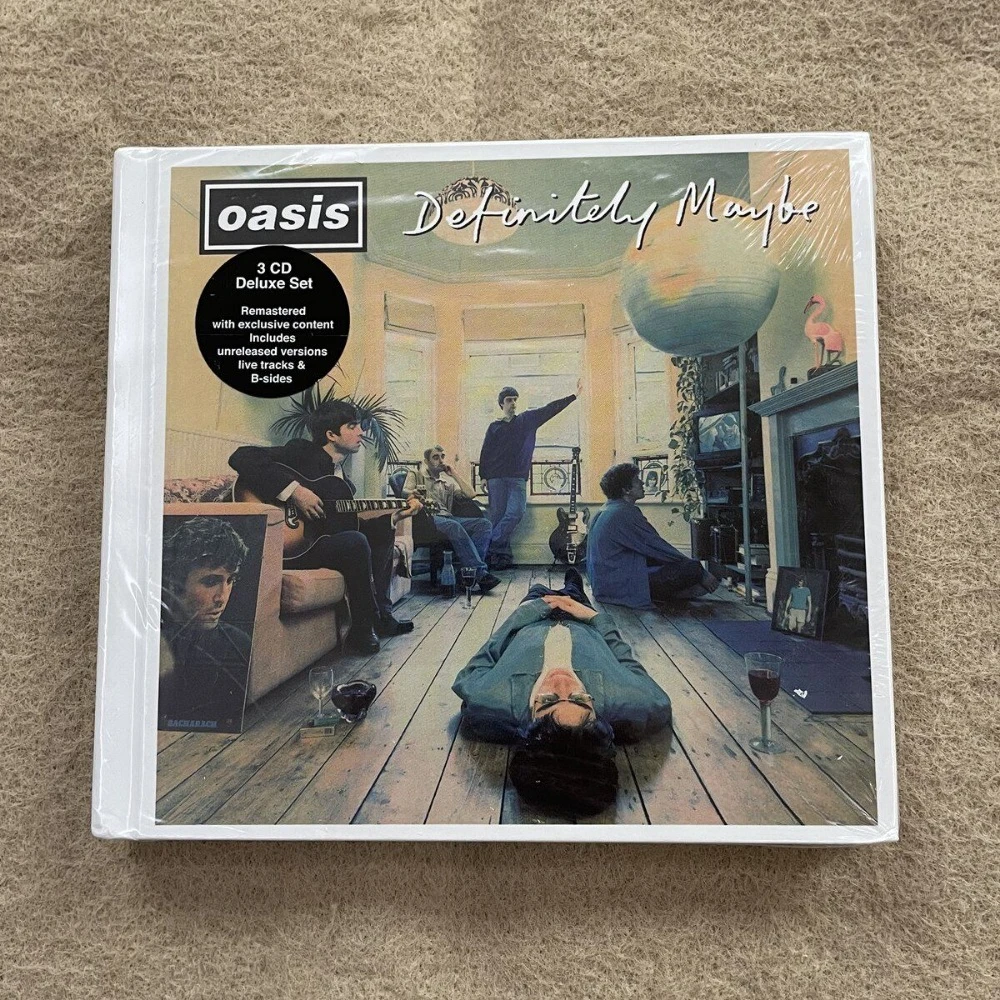 

Oasis Definitely Maybe 3CD Deluxe Remastered 2014 Edition: Дебютный брит-поп альбом с B-сайдами, демонстрационными версиями и живыми записями. Совершенно новый, запечатанный, в наличии.