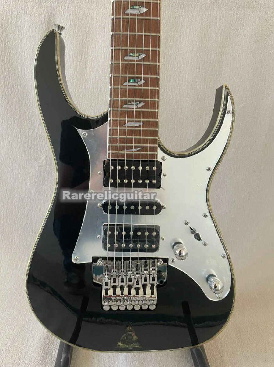Hot Selling UV777 7-string Black Electric Guitar,double-locking Tremolo Bridge, Pyramid Inlays, Abalone Sunburst Top,HSH Pickups